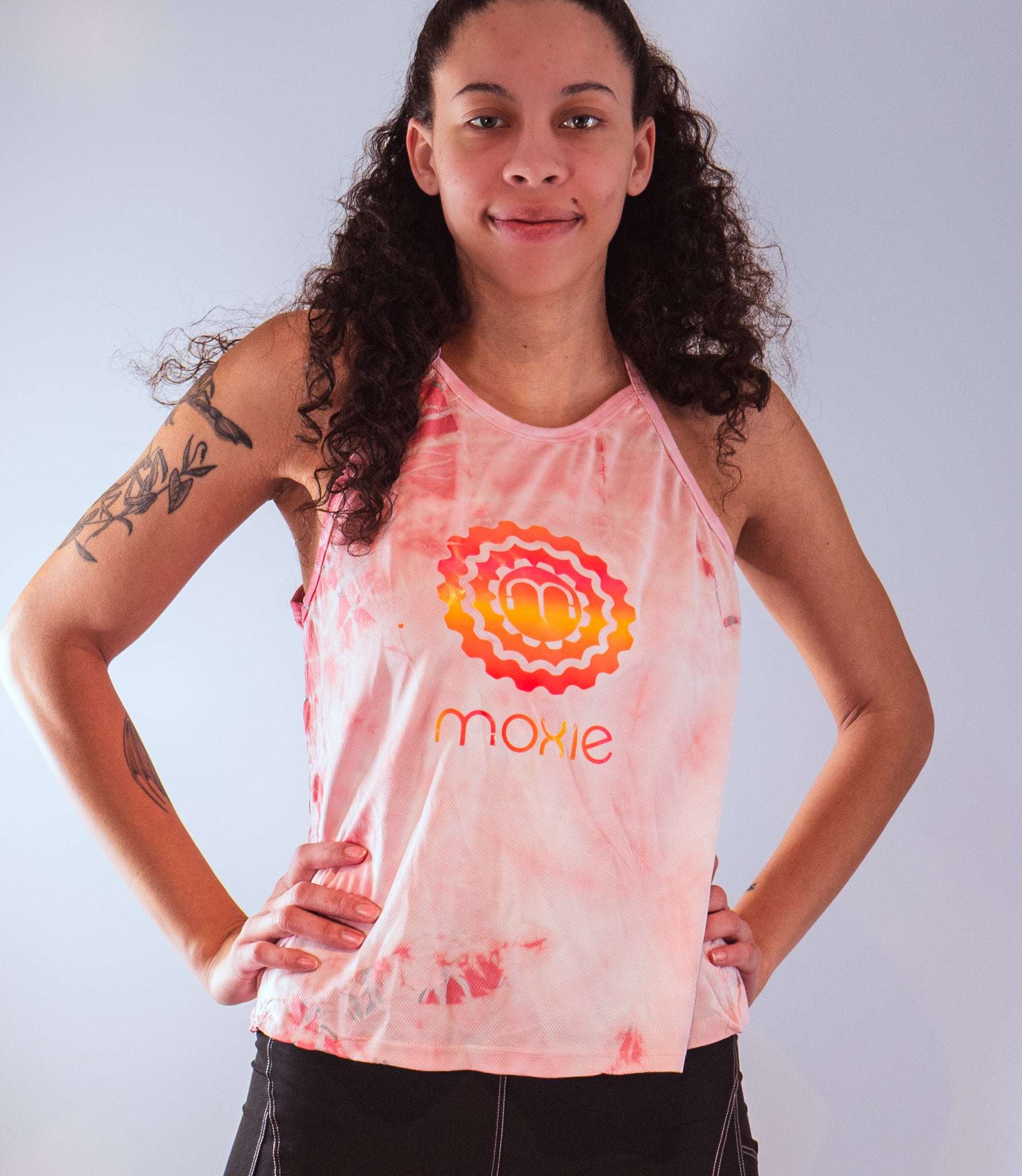Women's sleeveless tie dye bike top with Moxie logo and breathable active spandex fabric